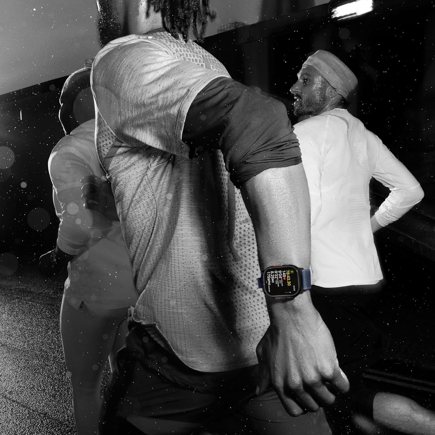 Person wearing a smartwatch with a blurred background